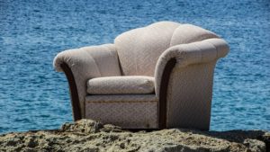 An armchair on the beach.